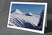 Fotokarte F104644: Alphütten in sonniger Winterlandschaft